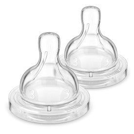 Two clear anti colic baby bottle nipples on a white background