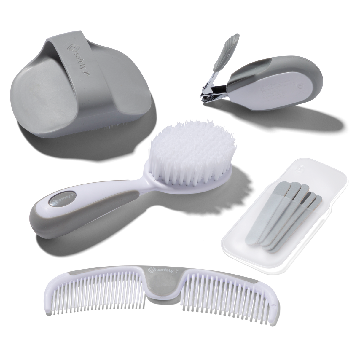 Set of grooming tools including a comb, brush, and other accessories on a white background
