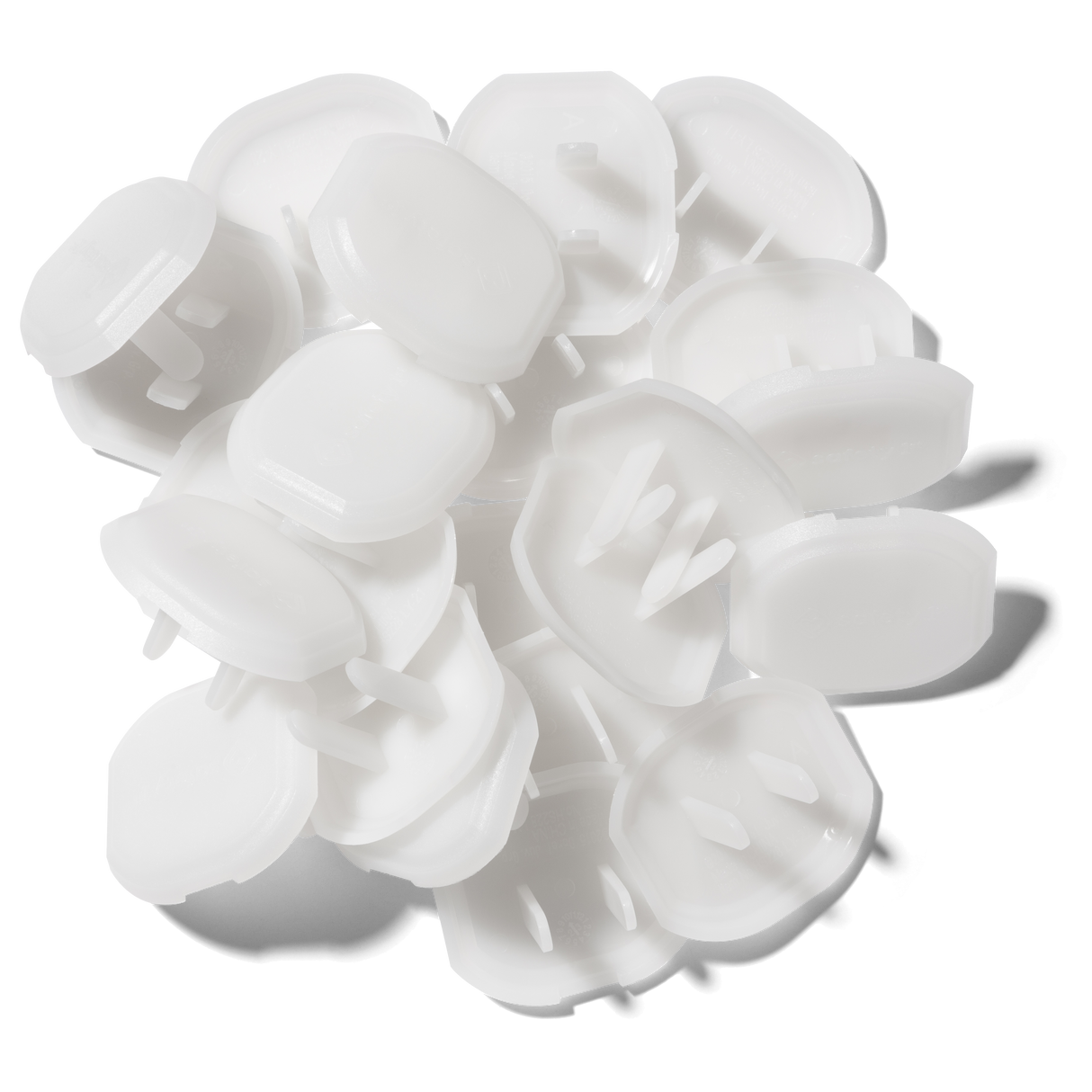 White plastic bottle caps on a white background