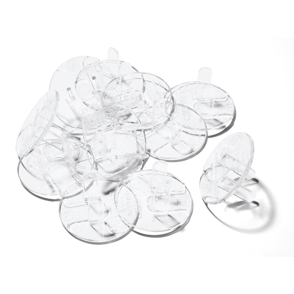 Clear plastic plug protectors on a white background