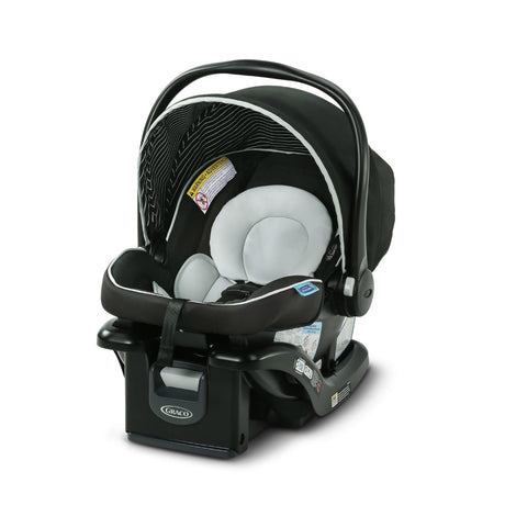 A product image of the Graco Snugride Lite XL Infant Car Seat. A black infant car seat with light grey accents featuring a canopy hood and handle positioned upwards and base. 