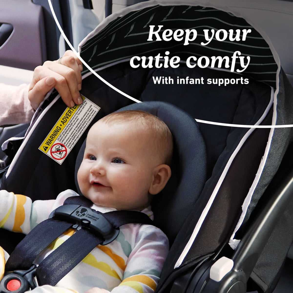 Close up image of a baby sitting in a Graco SnugRide Lite XL Infant Car Seat with text graphics reading "Keep your cutie comfy With infant supports."