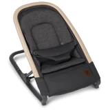 Baby bouncer with dark gray seat and beige frame on a white background