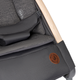 Close-up of a gray stroller with wooden handle and visible brand logo.