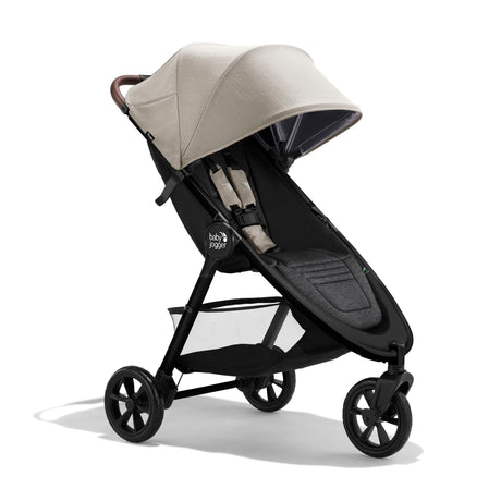 Black and beige stroller on a white background