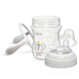 Baby bottle with accessories on a white background