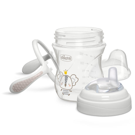Baby bottle with accessories on a white background