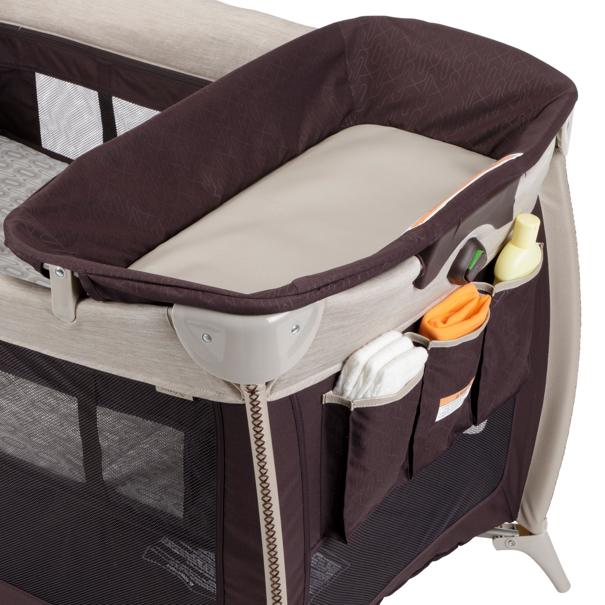 Baby bassinet with storage pockets and toys on a white background