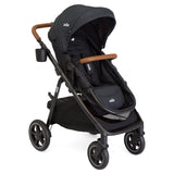 Black stroller with brown handles on a white background