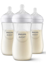 Three Philips Avent baby bottles with milk simulation on a white background
