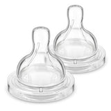 Two clear anti-colic baby bottle nipples on a white background