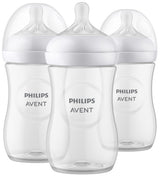 Three Philips Avent baby bottles with white caps on a white background