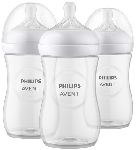 Three Philips Avent baby bottles with white caps on a white background