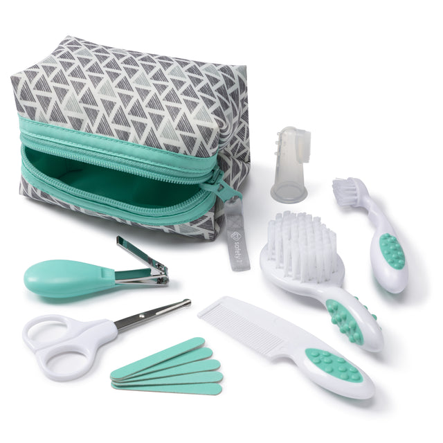 Baby grooming kit with a patterned pouch, brush, comb, scissors, and other tools on a white background.