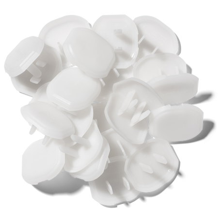 White plastic bottle caps on a white background