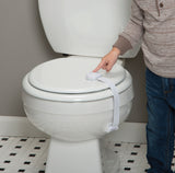 Person using a toilet seat cover attachment on a white toilet.