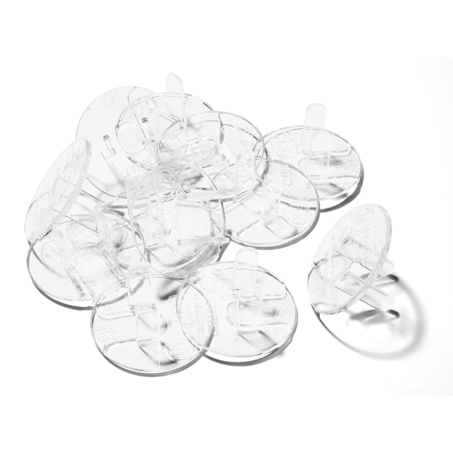 Clear plastic plug protectors on a white background